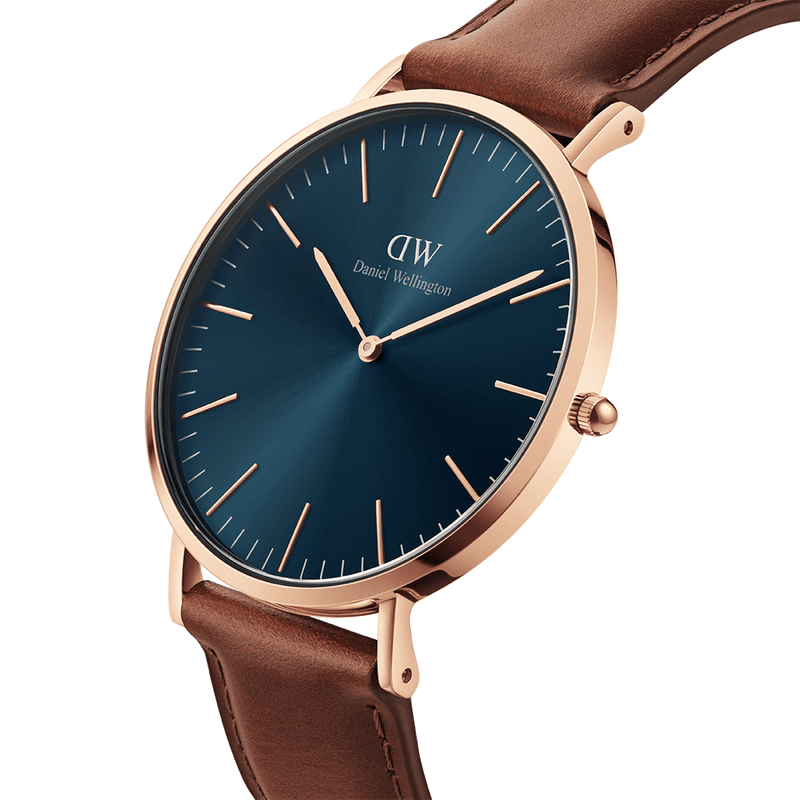 Elegant wristwatch with a blue dial, rose gold case, and brown leather strap.