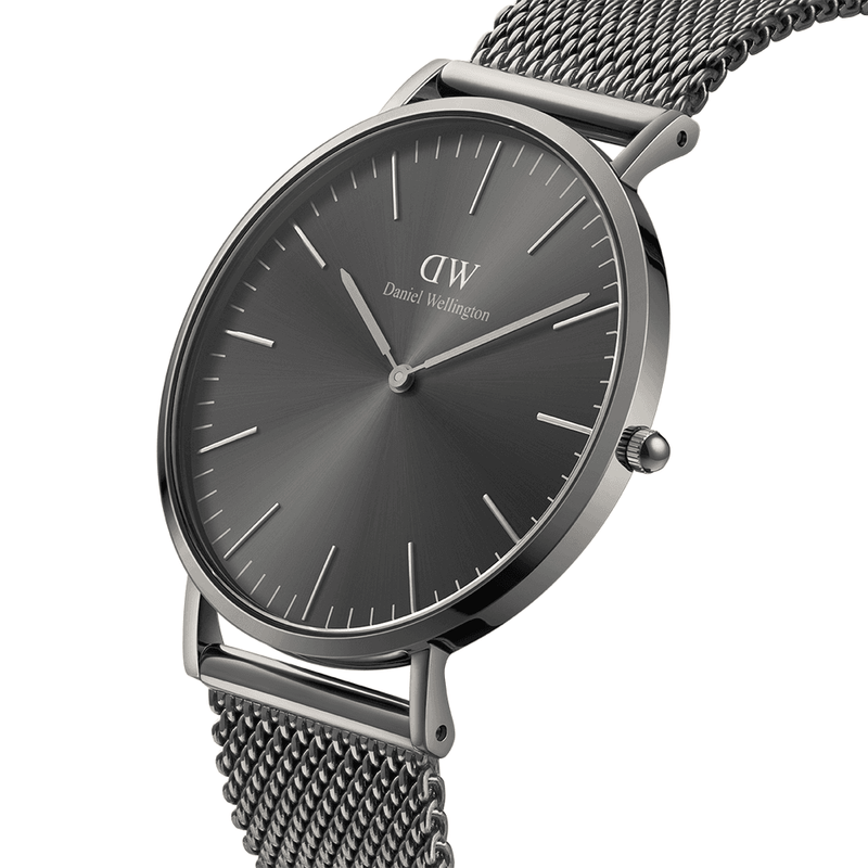 Sleek wristwatch with a dark gray face and mesh metal band.