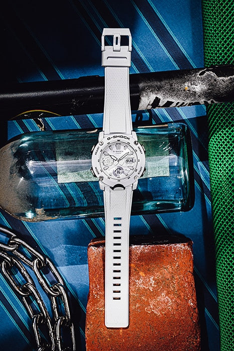 White wristwatch with a circular face and prominent bezel.