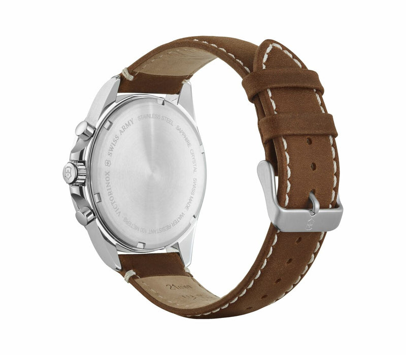 Wristwatch with a silver case and brown leather strap.