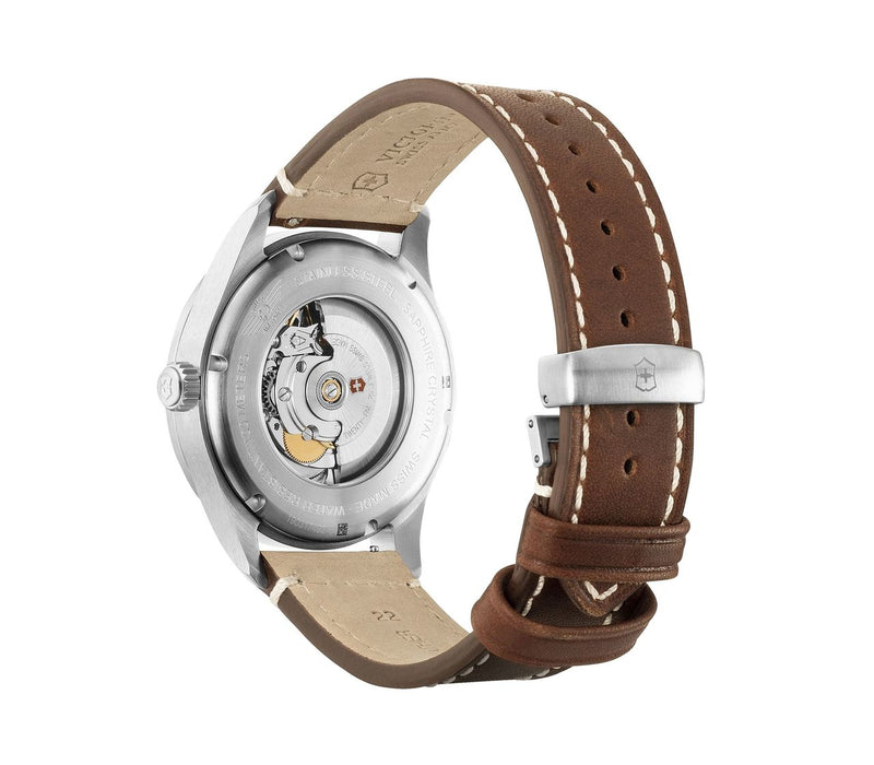 Wristwatch with a brown leather strap and visible mechanical movement through the transparent case back.
