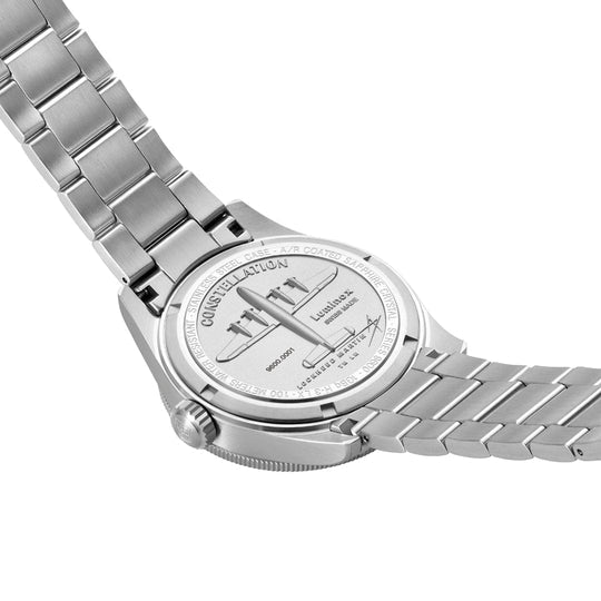 Silver wristwatch with a metal bracelet band, showing its caseback.