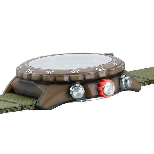 Rugged sports watch with a brown bezel and green fabric strap.