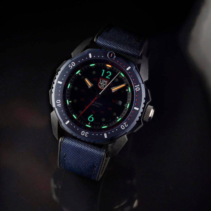 Sleek sports watch with a dark face and colorful luminous markers.