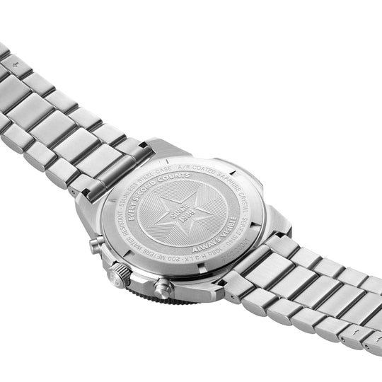 Stainless steel wristwatch with a metal bracelet band, showing its engraved caseback.