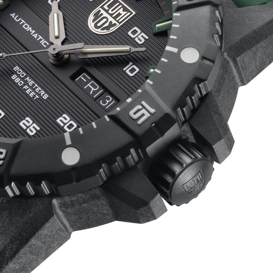 Close-up view of a rugged wristwatch face and crown.
