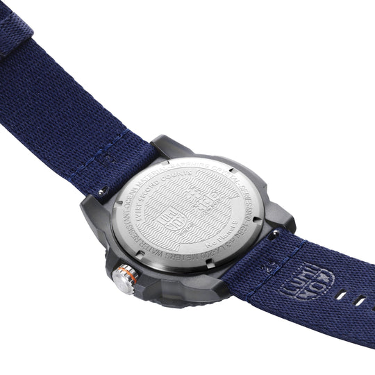 Wristwatch with a navy blue fabric strap and metal case back.