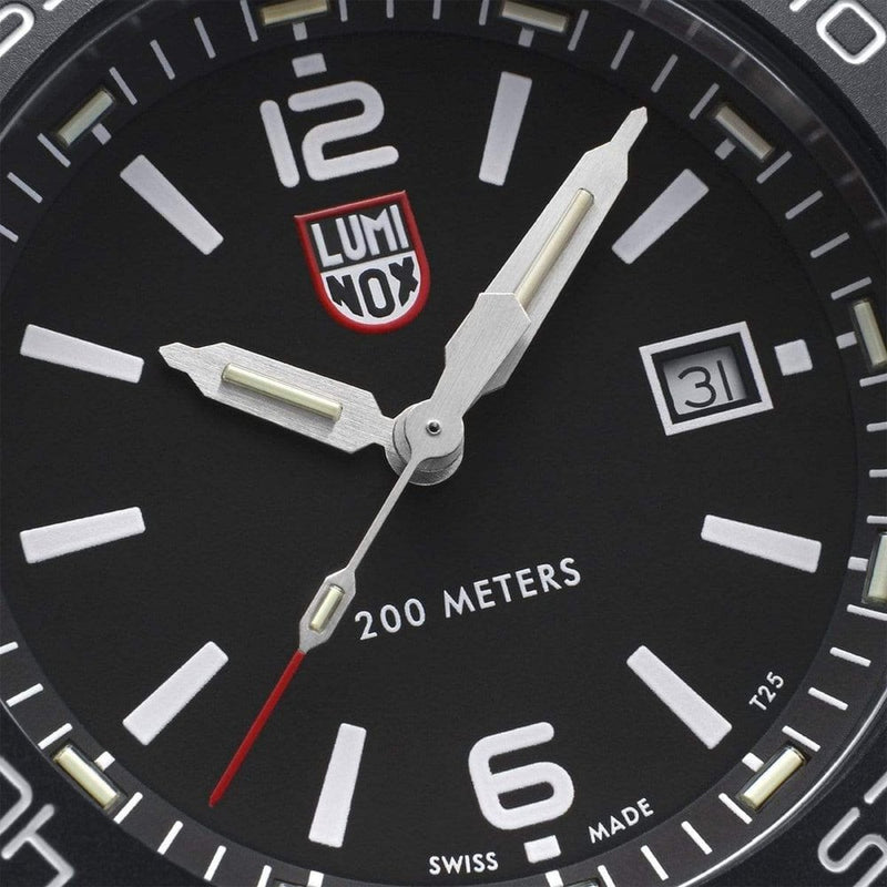 Close-up view of a black-faced Luminox wristwatch dial showing 10:10 time.